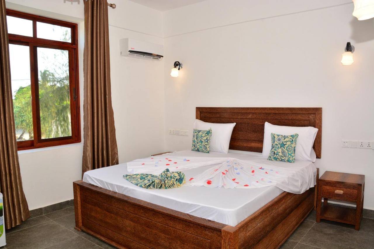 Bright Standard Double room with carved wooden furniture and AC